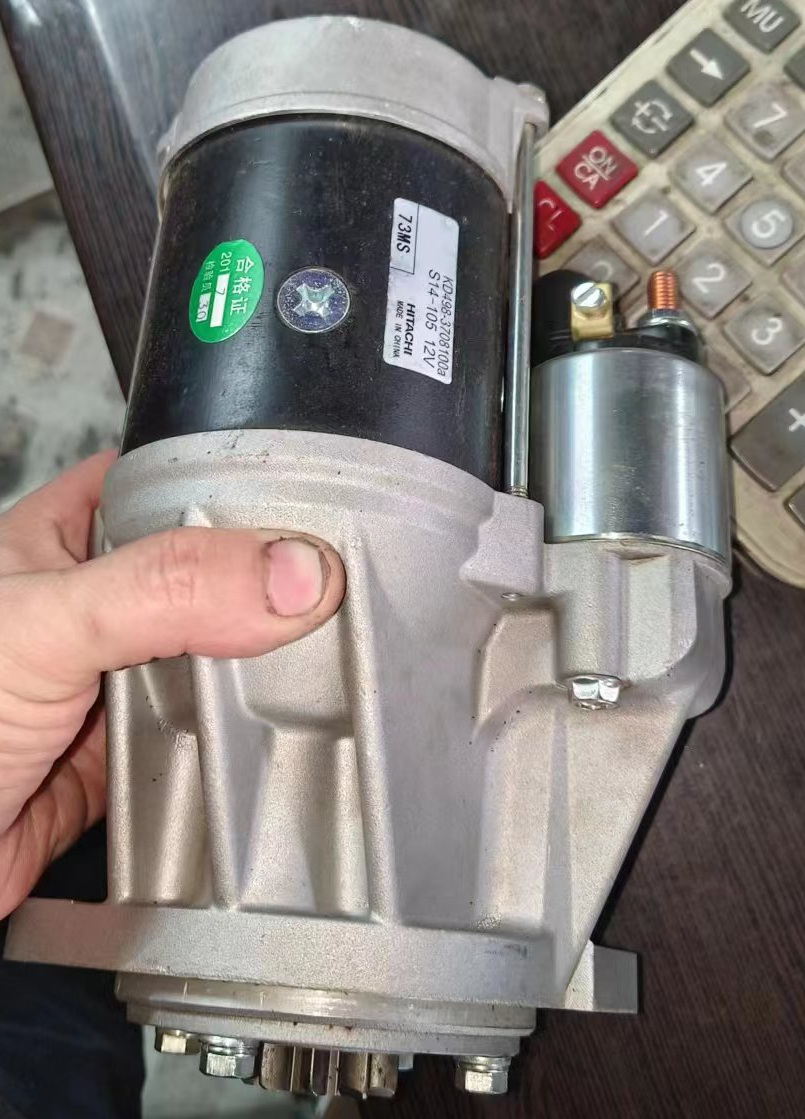Hand-held starter showing the main body, adjacent solenoid housing and label with S14-105 and 12V visible.